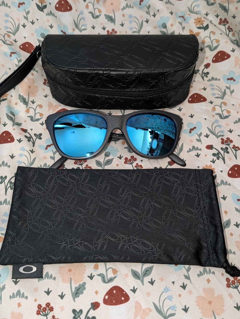 Oakley Women's Hold Out Blue Polarized Lens Sunglasses with Matte Black Frame
